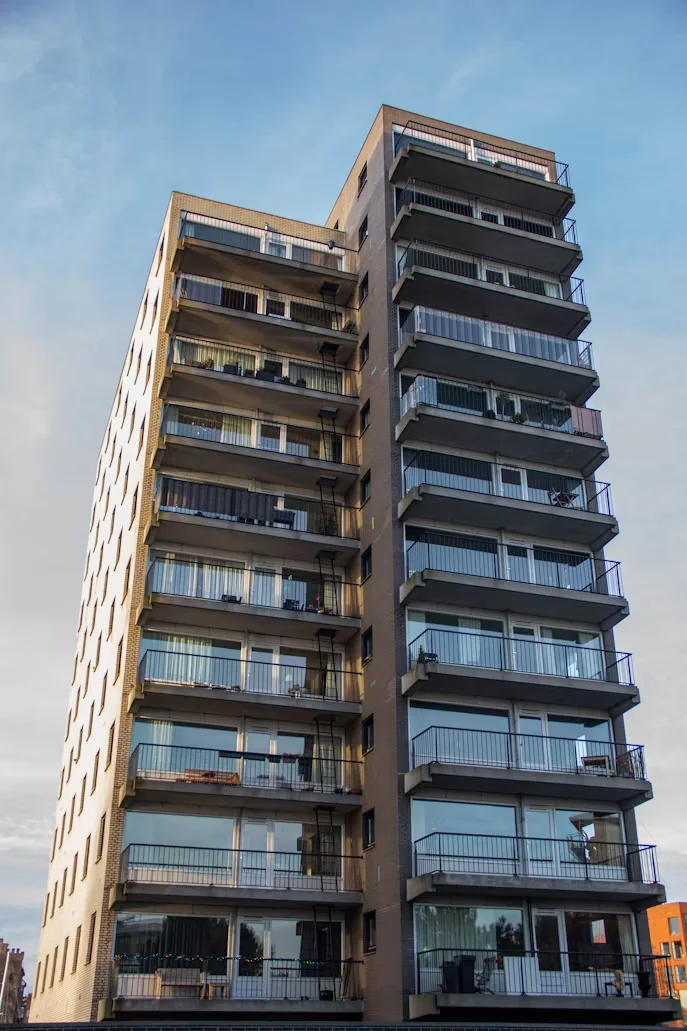 Apartment block with balconies on each floor